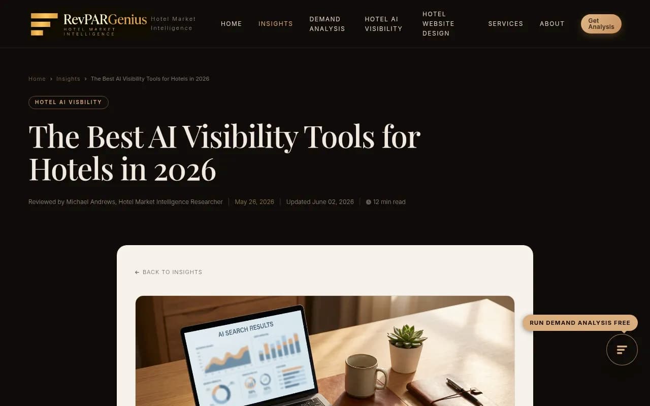 Editorial flat-lay of a hotel reception desk with a laptop showing an AI search results dashboard